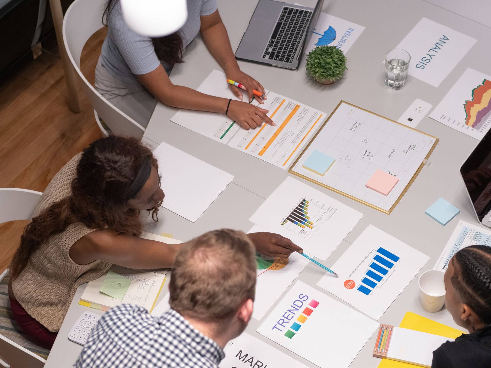 Team reviewing business charts and planning growth